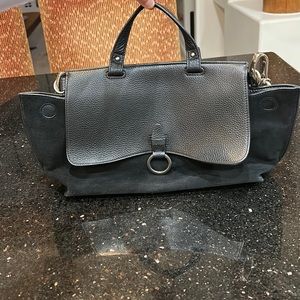 Rebecca Minkoff black leather and suede bag with silver metal detail.